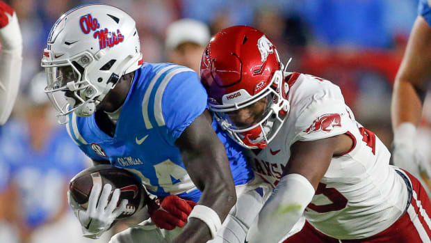 Razorbacks' linebacker Jaheim Thomas makes a tackle on Ole Miss' Ulysses Bentley